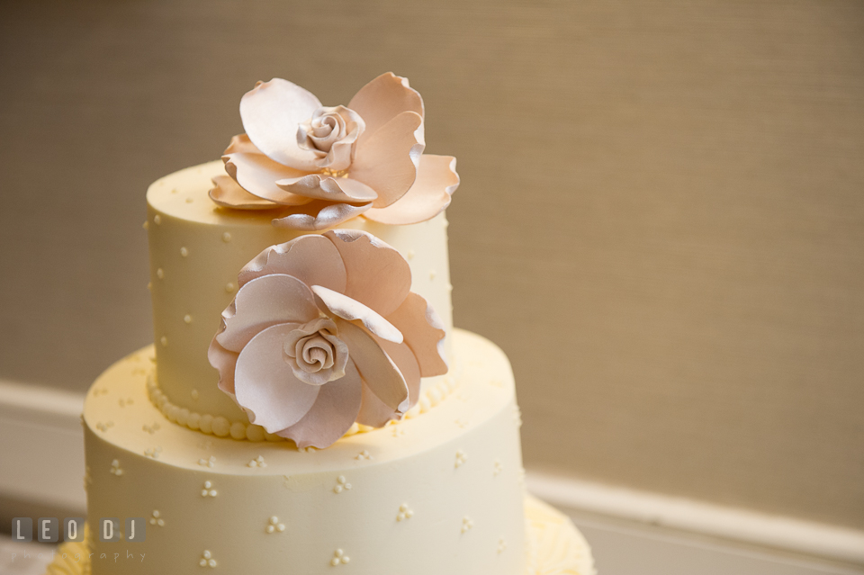 Close up of flower wedding cake decor by Sugar Bakers Cakes. Loews Annapolis Hotel Maryland wedding, by wedding photographers of Leo Dj Photography. http://leodjphoto.com