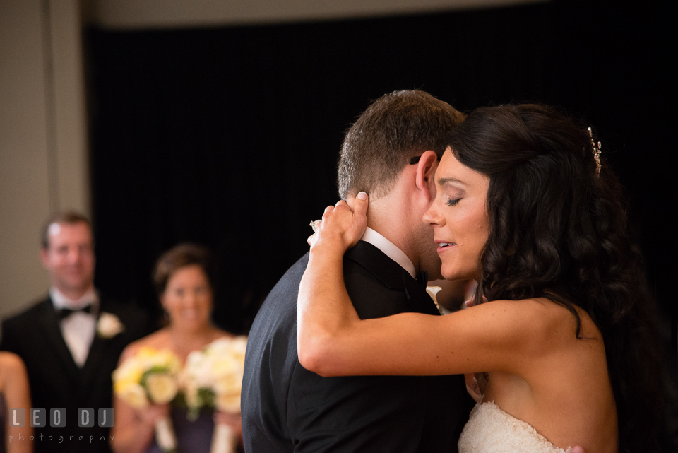 Bride hugging Groom during first dance. Loews Annapolis Hotel Maryland wedding, by wedding photographers of Leo Dj Photography. http://leodjphoto.com