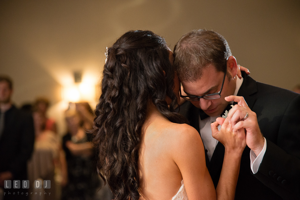 Groom cuddling with Bride during first dance. Loews Annapolis Hotel Maryland wedding, by wedding photographers of Leo Dj Photography. http://leodjphoto.com