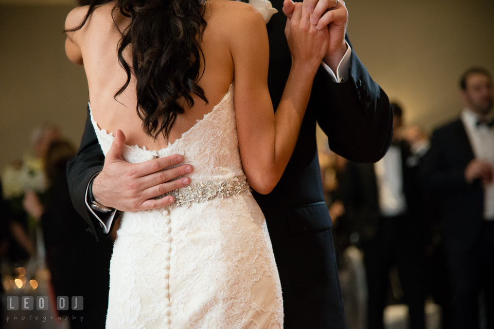 Groom embracing Bride during first dance. Loews Annapolis Hotel Maryland wedding, by wedding photographers of Leo Dj Photography. http://leodjphoto.com