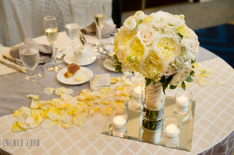 Setup of sweetheart table with Bride's flower bouquet by Violets Florists by Connie Clark. Loews Annapolis Hotel Maryland wedding, by wedding photographers of Leo Dj Photography. http://leodjphoto.com