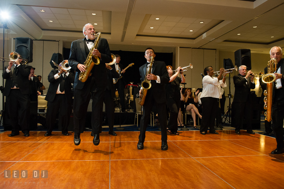 Saxophone players from Mood Swings Band jumping while performing live. Loews Annapolis Hotel Maryland wedding, by wedding photographers of Leo Dj Photography. http://leodjphoto.com