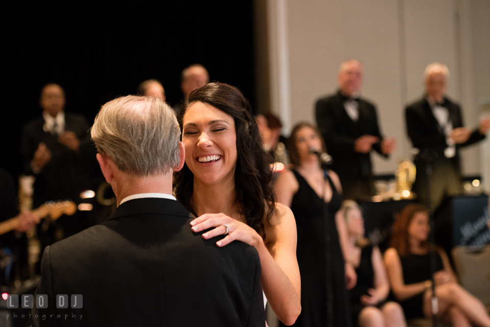 Bride laughing during parent dance with Father. Loews Annapolis Hotel Maryland wedding, by wedding photographers of Leo Dj Photography. http://leodjphoto.com