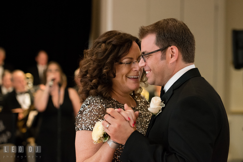 Mother of Groom and son laughing and dancing during parent dance. Loews Annapolis Hotel Maryland wedding, by wedding photographers of Leo Dj Photography. http://leodjphoto.com