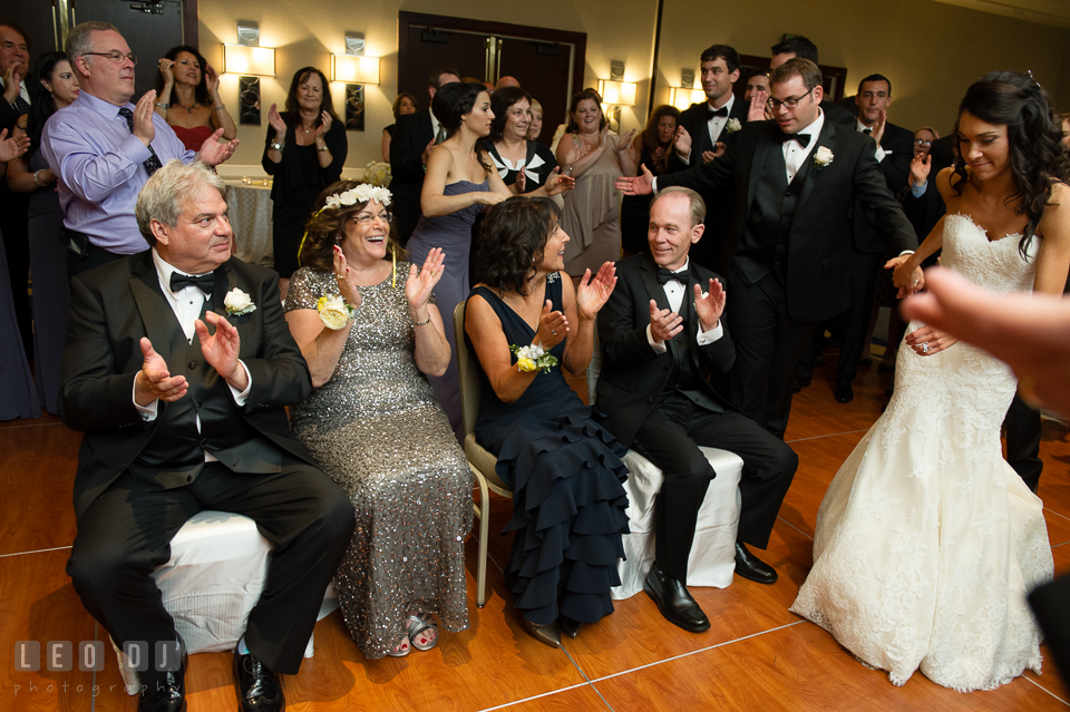 Guests circling parents during the flower crowning ritual Mezinke Tanz. Loews Annapolis Hotel Maryland wedding, by wedding photographers of Leo Dj Photography. http://leodjphoto.com