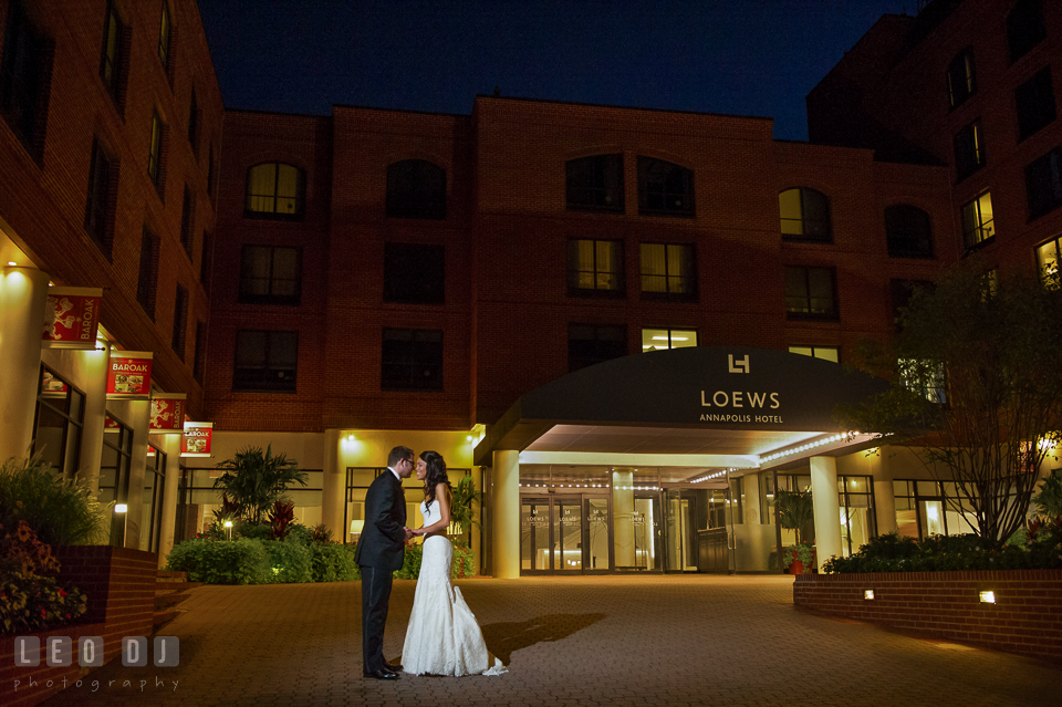 Bride and Groom almost kissing in front of the hotel entrance. Loews Annapolis Hotel Maryland wedding, by wedding photographers of Leo Dj Photography. http://leodjphoto.com