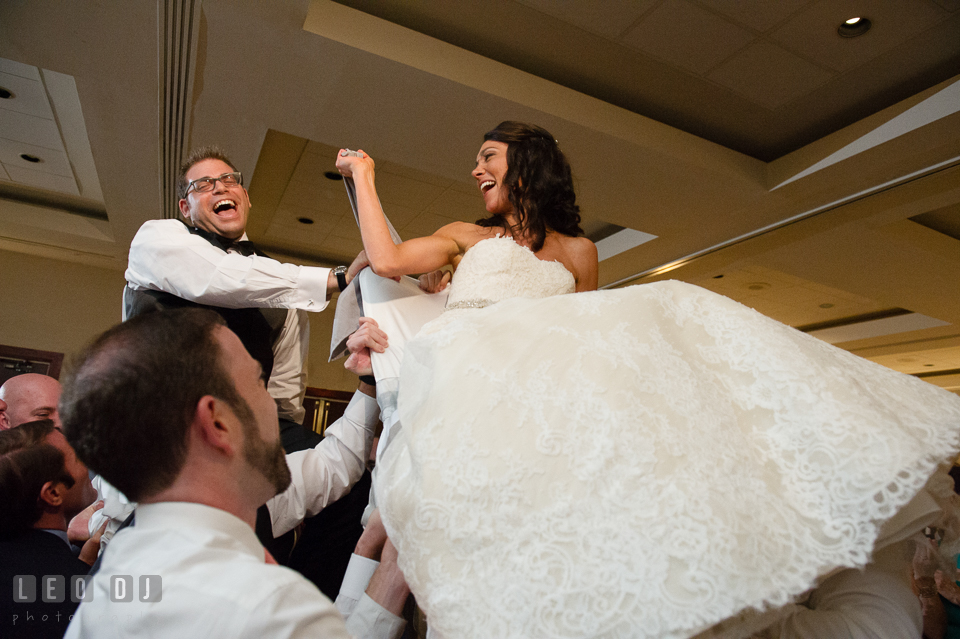 Bride and Groom raised up during Hora dance. Loews Annapolis Hotel Maryland wedding, by wedding photographers of Leo Dj Photography. http://leodjphoto.com