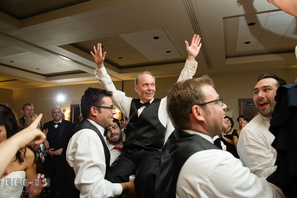 Father of Bride raised hands during Hora dance. Loews Annapolis Hotel Maryland wedding, by wedding photographers of Leo Dj Photography. http://leodjphoto.com