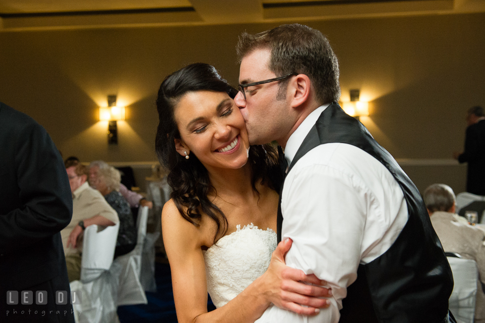 Groom kissing Bride passionately during open dance. Loews Annapolis Hotel Maryland wedding, by wedding photographers of Leo Dj Photography. http://leodjphoto.com