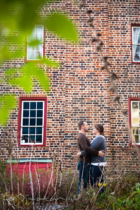 Engaged guy holding his fiancee. Pre-wedding or engagement photo session at Annapolis city harbor, Maryland, Eastern Shore, by wedding photographers of Leo Dj Photography.