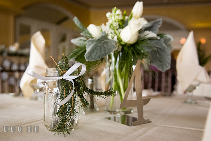 Table decorations and custom made metal table number. The Ballroom at The Chesapeake Inn wedding ceremony photos, Chesapeake City, Maryland by photographers of Leo Dj Photography.