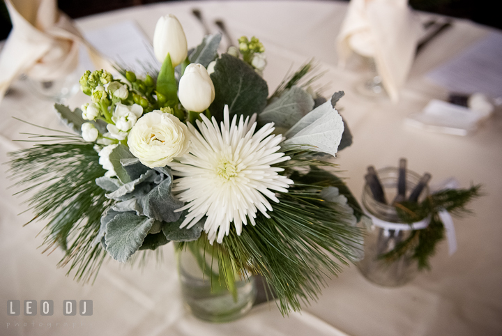 Floral table centerpiece with white rose and tulip. The Ballroom at The Chesapeake Inn wedding ceremony photos, Chesapeake City, Maryland by photographers of Leo Dj Photography.