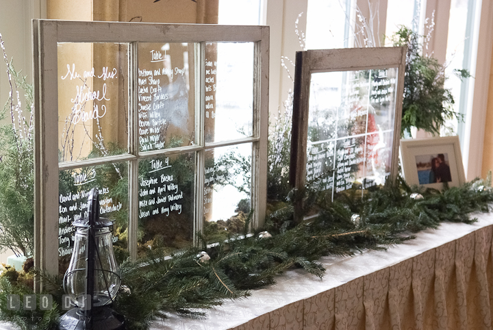Table seating assignment list on window. The Ballroom at The Chesapeake Inn wedding ceremony photos, Chesapeake City, Maryland by photographers of Leo Dj Photography.