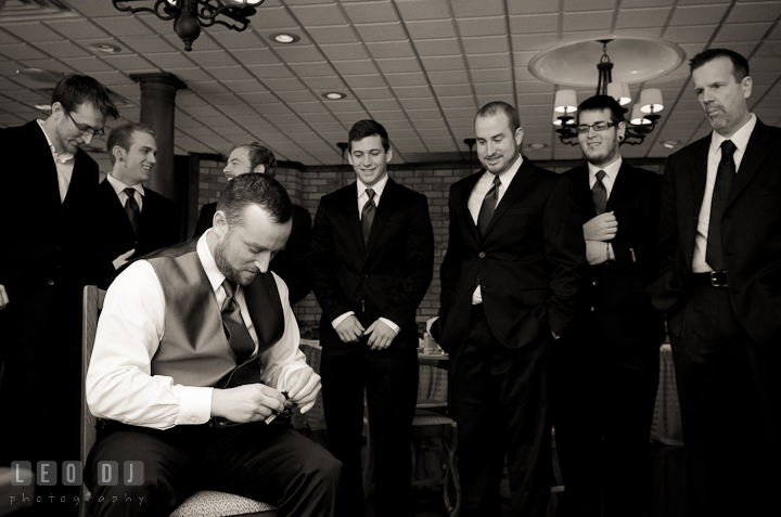 Groom opening gift watch from the Bride. The Ballroom at The Chesapeake Inn wedding ceremony photos, Chesapeake City, Maryland by photographers of Leo Dj Photography.