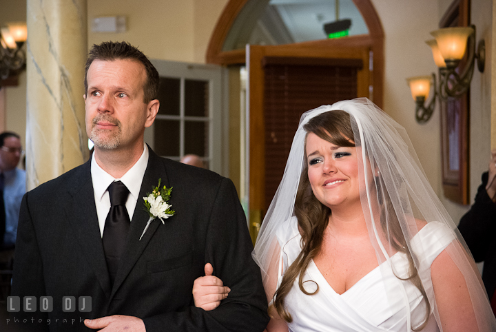 Bride escorted by Father walking down the isle for procession ceremony. The Ballroom at The Chesapeake Inn wedding ceremony photos, Chesapeake City, Maryland by photographers of Leo Dj Photography.