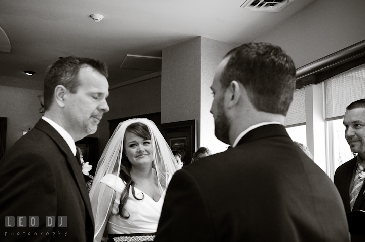 Bride looking at Father whom giving away daughter to groom. The Ballroom at The Chesapeake Inn wedding ceremony photos, Chesapeake City, Maryland by photographers of Leo Dj Photography.