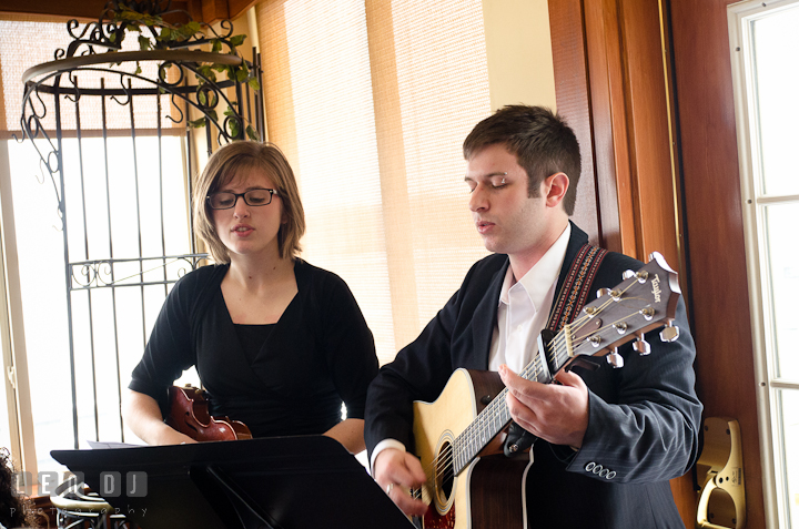 Music performer and singer during the ceremony. The Ballroom at The Chesapeake Inn wedding ceremony photos, Chesapeake City, Maryland by photographers of Leo Dj Photography.