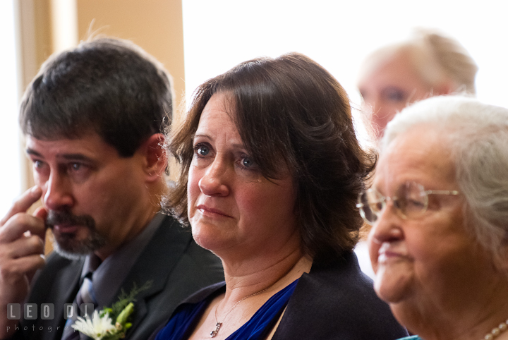 Mother of Groom shed tear during the ceremony. The Ballroom at The Chesapeake Inn wedding ceremony photos, Chesapeake City, Maryland by photographers of Leo Dj Photography.