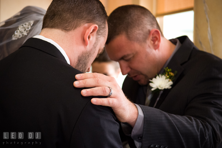 Blessings from the pastor for the Bride and Groom. The Ballroom at The Chesapeake Inn wedding ceremony photos, Chesapeake City, Maryland by photographers of Leo Dj Photography.