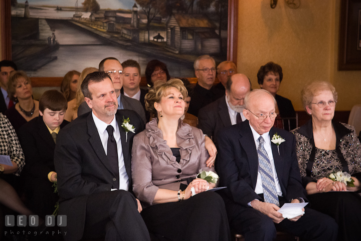 Mother, father, grandparents and guests smiling. The Ballroom at The Chesapeake Inn wedding ceremony photos, Chesapeake City, Maryland by photographers of Leo Dj Photography.