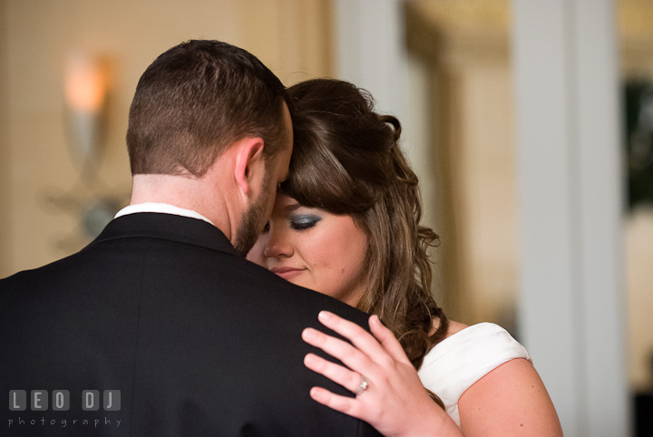 Bride and groom holding each other during first dance. The Ballroom at The Chesapeake Inn wedding reception photos, Chesapeake City, Maryland by photographers of Leo Dj Photography.