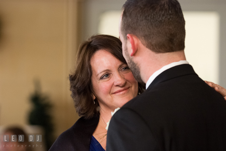 Mother of the Bride smiling while dancing with son. The Ballroom at The Chesapeake Inn wedding reception photos, Chesapeake City, Maryland by photographers of Leo Dj Photography.