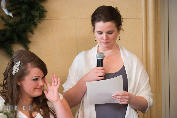 Bride emotional listening to Matron of Honor's speech. The Ballroom at The Chesapeake Inn wedding reception photos, Chesapeake City, Maryland by photographers of Leo Dj Photography.