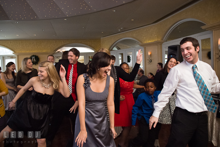 Bridesmaid and guests laughing having fun dancing at the party. The Ballroom at The Chesapeake Inn wedding reception photos, Chesapeake City, Maryland by photographers of Leo Dj Photography.