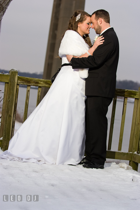 Bride and Groom holding close to each other. The Ballroom at The Chesapeake Inn wedding reception photos, Chesapeake City, Maryland by photographers of Leo Dj Photography.