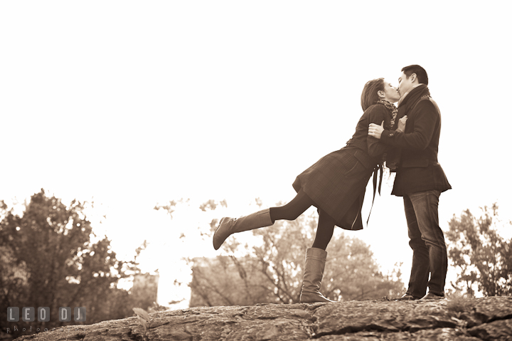 Engaged guy kissing with his fiancée. Pre-wedding engagement photo session at New York City, NY, by wedding photographers of Leo Dj Photography. http://leodjphoto.com