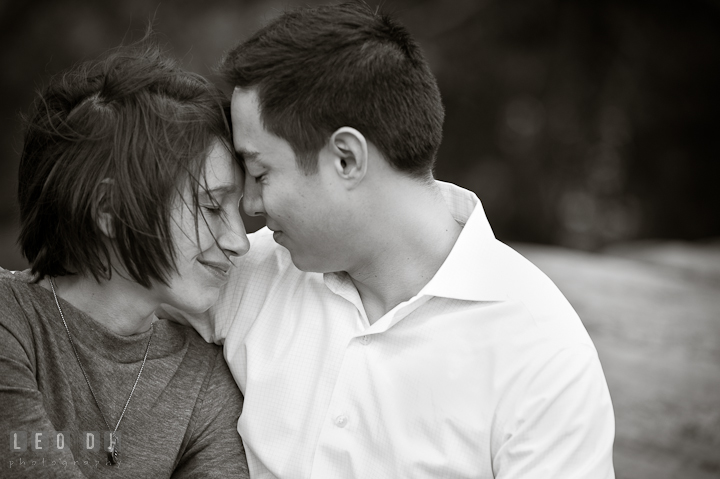 Engaged girl cuddling with her fiancé at Central Park. Pre-wedding engagement photo session at New York City, NY, by wedding photographers of Leo Dj Photography. http://leodjphoto.com