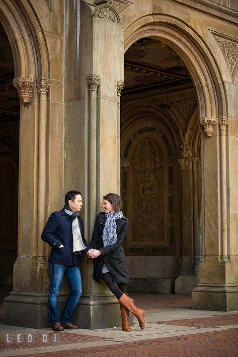 Engaged couple holding hands at Bethesda Terrace, Central Park. Pre-wedding engagement photo session at New York City, NY, by wedding photographers of Leo Dj Photography. http://leodjphoto.com