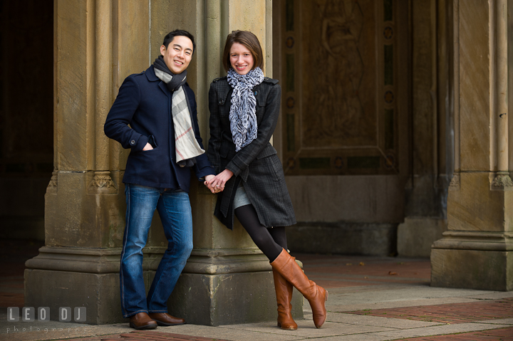 Engaged couple posing and smiling at Bethesda Terrace, Central Park. Pre-wedding engagement photo session at New York City, NY, by wedding photographers of Leo Dj Photography. http://leodjphoto.com