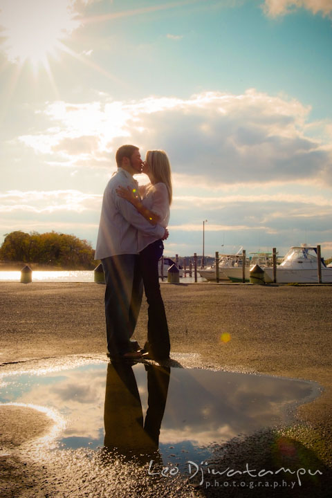 Engaged couple kissing with the sun and awesome clouds behind them. Stevensville, Kent Island, Maryland, Pre-Wedding Engagement Photographer, Leo Dj Photography