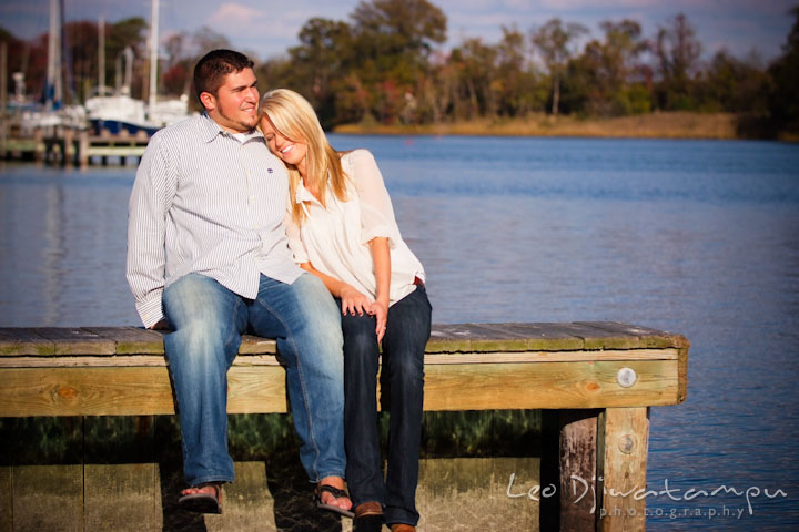 Engaged girl leaning on her fiancée's shoulder, at a pier. Stevensville, Kent Island, Maryland, Pre-Wedding Engagement Photographer, Leo Dj Photography