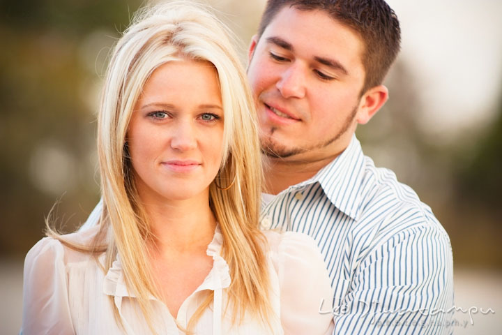 Engaged girl smiling while her fiancé hugged her from behind. Stevensville, Kent Island, Maryland, Pre-Wedding Engagement Photographer, Leo Dj Photography