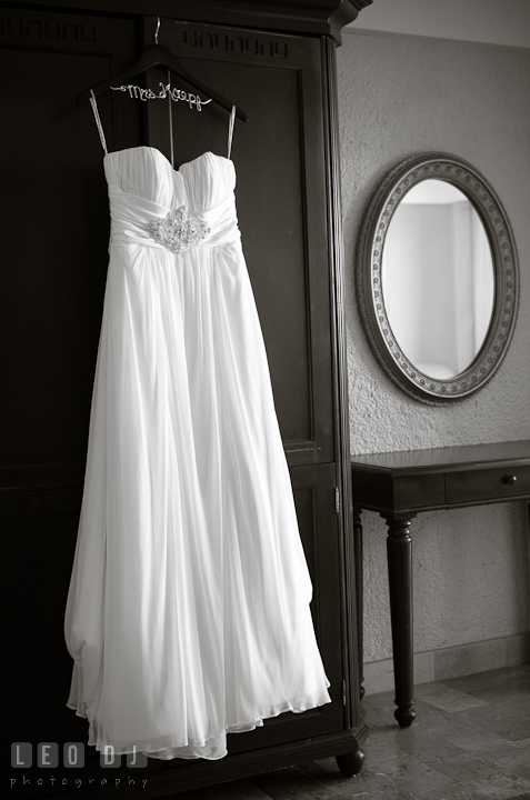 Wedding dress hung by a wardrobe. Cruise ship destination wedding ceremony photos, Hotel Melia Cozumel Mexico by photographers of Leo Dj Photography.