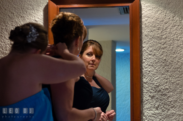 Bride helping mother putting necklace. Cruise ship destination wedding ceremony photos, Hotel Melia Cozumel Mexico by photographers of Leo Dj Photography.