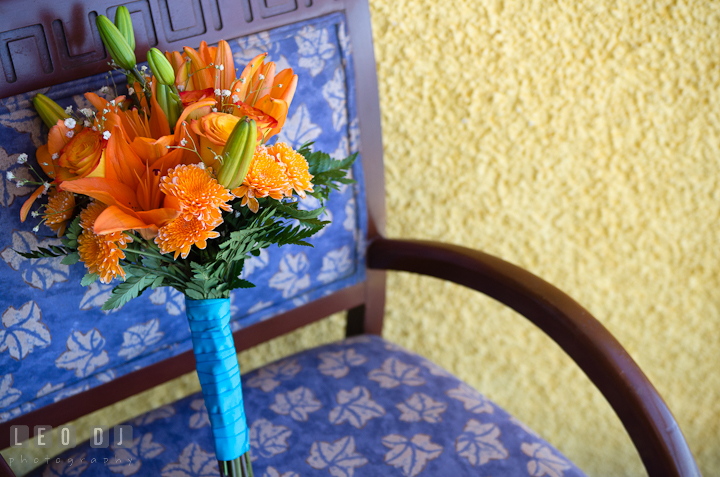 Orange flower bouquet. Cruise ship destination wedding ceremony photos, Hotel Melia Cozumel Mexico by photographers of Leo Dj Photography.
