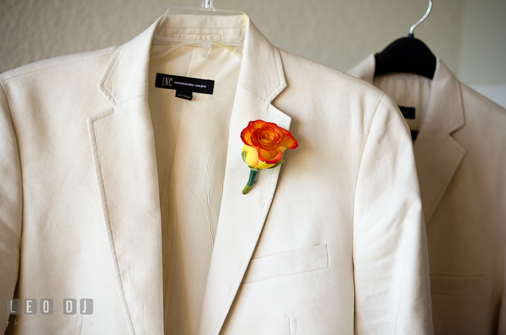 Groom and Best Man's jacket with orange flower boutonniere. Cruise ship destination wedding ceremony photos, Hotel Melia Cozumel Mexico by photographers of Leo Dj Photography.