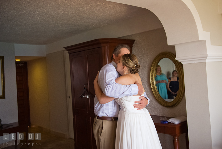 Bride hugging his Father one last time before walking down the isle. Cruise ship destination wedding ceremony photos, Hotel Melia Cozumel Mexico by photographers of Leo Dj Photography.
