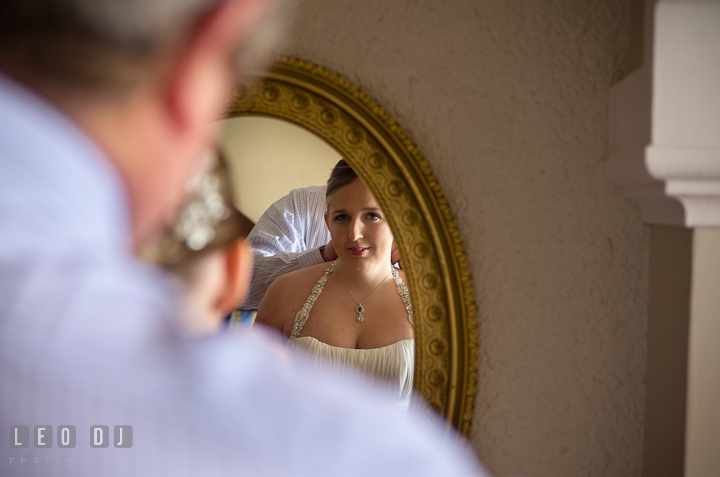 View from the mirror Father of the Bride helping daughter. Cruise ship destination wedding ceremony photos, Hotel Melia Cozumel Mexico by photographers of Leo Dj Photography.