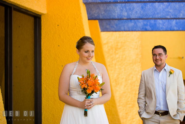 Bride sensed that Groom was coming during first glance. Cruise ship destination wedding ceremony photos, Hotel Melia Cozumel Mexico by photographers of Leo Dj Photography.