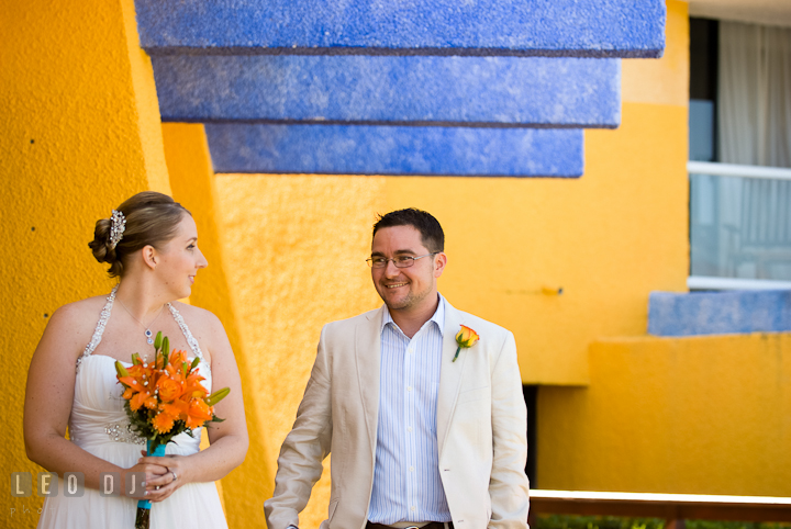 Bride's and Groom's eyes finally met during first glance. Cruise ship destination wedding ceremony photos, Hotel Melia Cozumel Mexico by photographers of Leo Dj Photography.