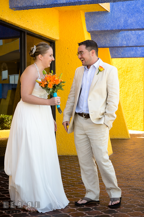 Bride and Groom laughing together after first glance. Cruise ship destination wedding ceremony photos, Hotel Melia Cozumel Mexico by photographers of Leo Dj Photography.