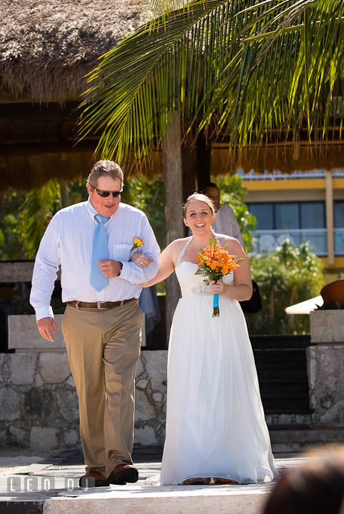 Father of the Bride escorting daughter walking down the isle. Cruise ship destination wedding ceremony photos, Hotel Melia Cozumel Mexico by photographers of Leo Dj Photography.