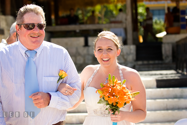 Bride being escorted by her Dad walking down the isle. Cruise ship destination wedding ceremony photos, Hotel Melia Cozumel Mexico by photographers of Leo Dj Photography.