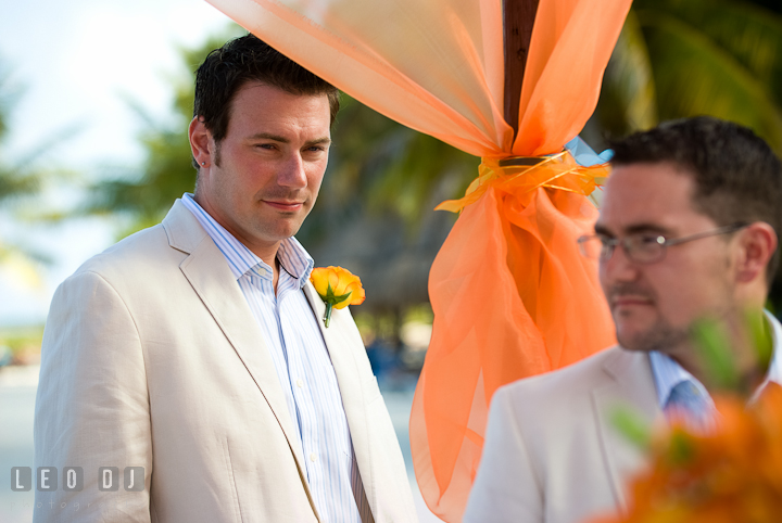 Best man looking at Groom. Cruise ship destination wedding ceremony photos, Hotel Melia Cozumel Mexico by photographers of Leo Dj Photography.