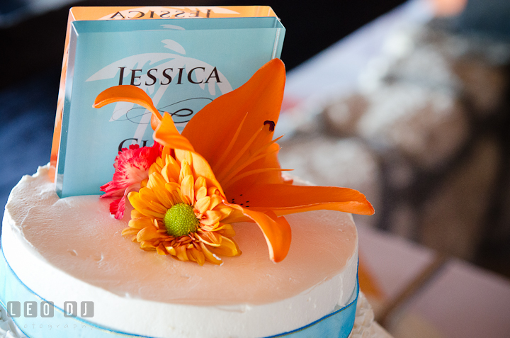 Flower decoration and wedding cake topping. Carnival Cruise ship destination wedding reception photos of Jessica and Chad, Cozumel Mexico by photographers of Leo Dj Photography.