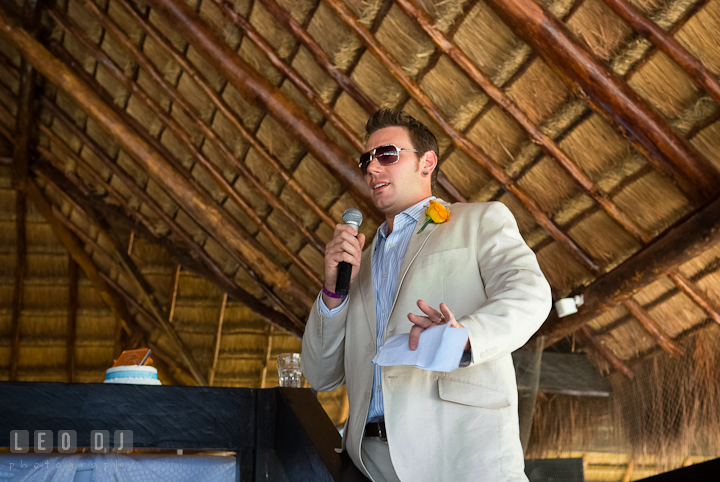 Best man delivering his speech. Carnival Cruise ship destination wedding reception photos of Jessica and Chad, Cozumel Mexico by photographers of Leo Dj Photography.